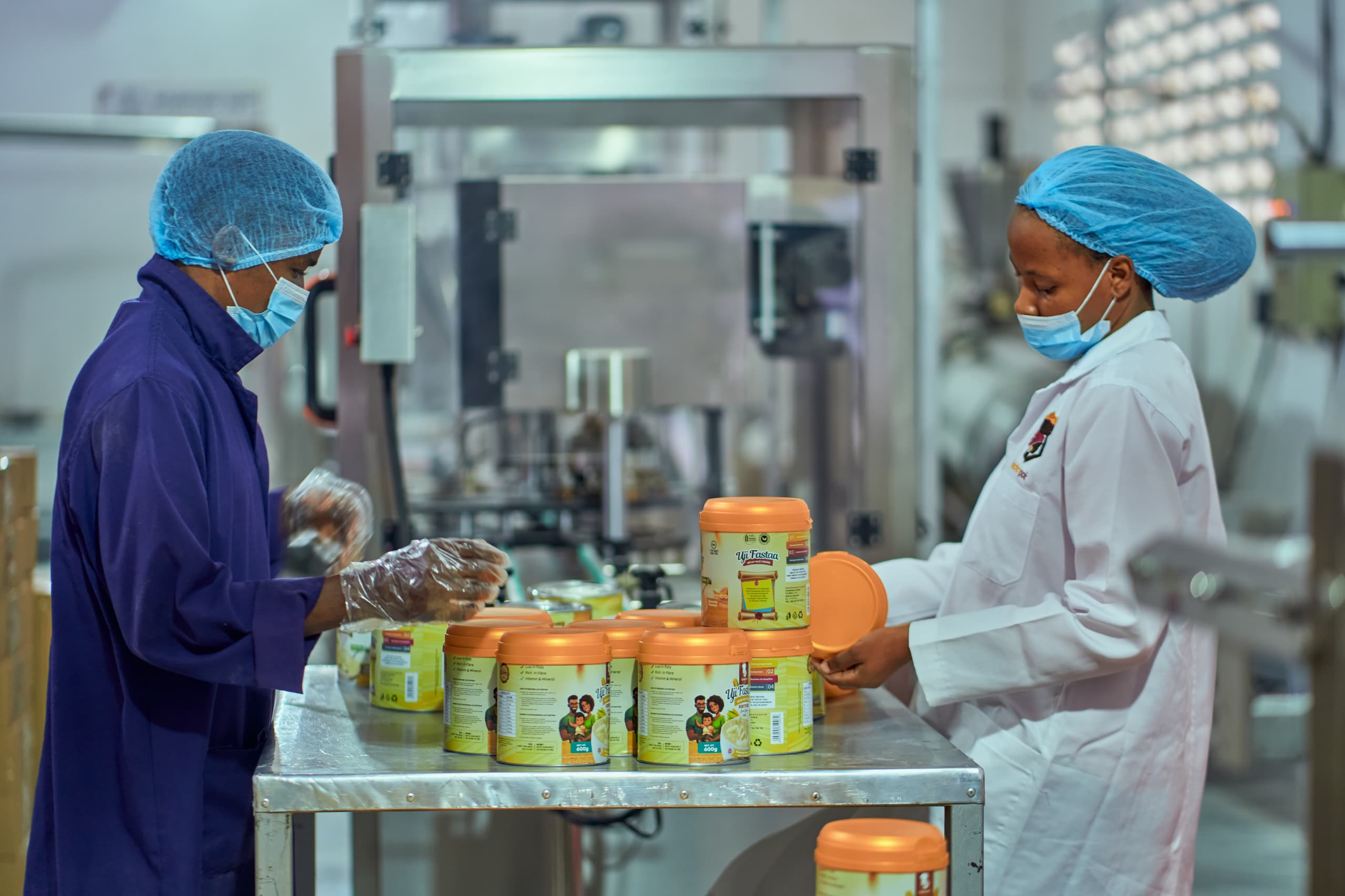 Goldenpot production facility with workers packaging Uji Fastaa products